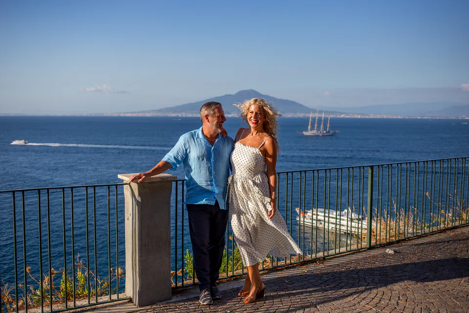 Couple overlooking the sea and Vesuvius