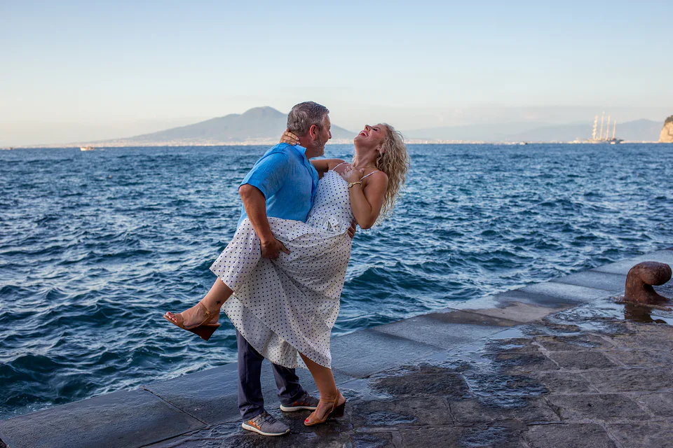 Couple smiling in bright coastal light